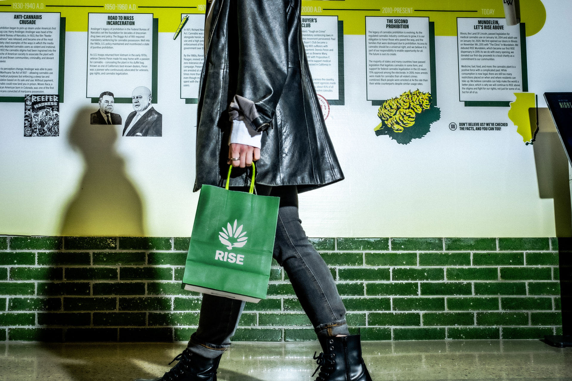 A woman walking through the RISE Dispensary